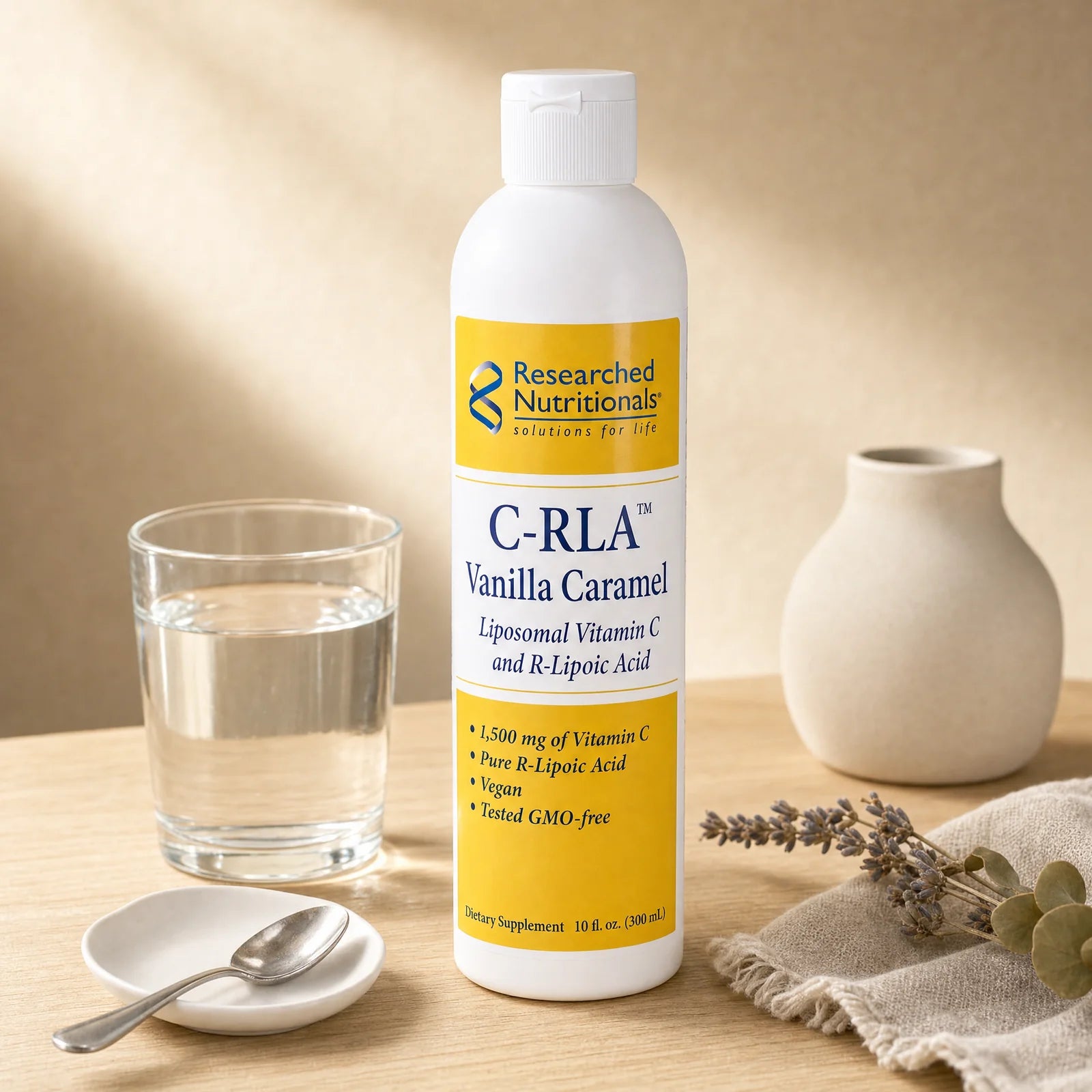 C-RLA Vanilla Caramel liposomal Vitamin C mixed into a glass of water on a kitchen counter