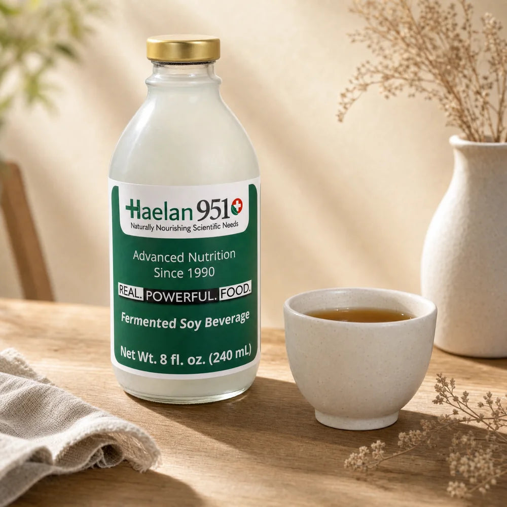 Haelan 951 Wellness Serving poured into a glass on a light oak surface, daily whole-food liquid nutrition